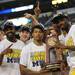 Michigan basketball holds their NCAA South Regional Champion trophy as they celebrate being Florida in the Elite Eight and advancing to the Final Four at Cowboys Stadium on Sunday, March 31, 2013. Melanie Maxwell I AnnArbor.com